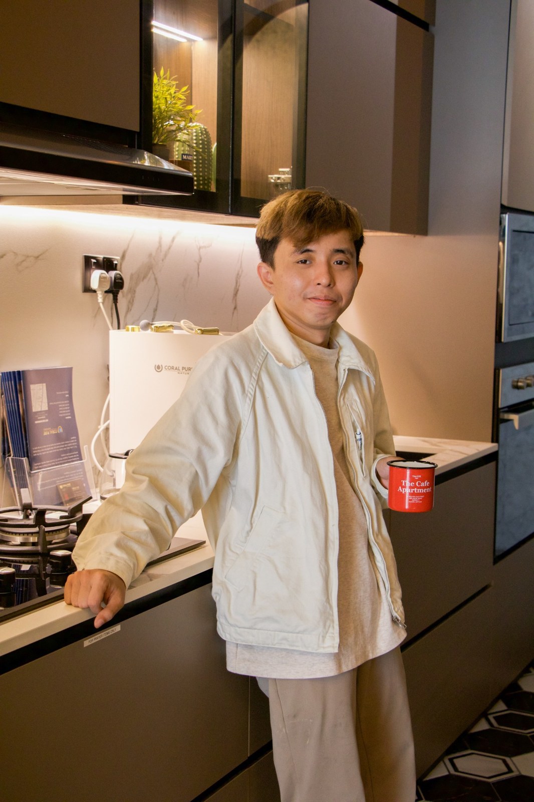 Portrait of Alfred Tan in an interior setting